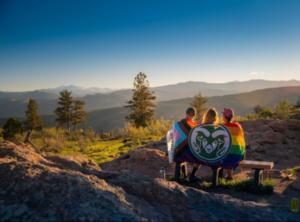 CSU students embody inclusive excellence, taking in a sunset together as the day ends in the mountains