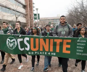Group of students holding a CSUnite banner